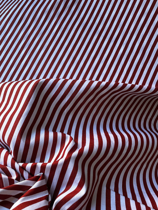 Tessuto a righe rosso/bruciato