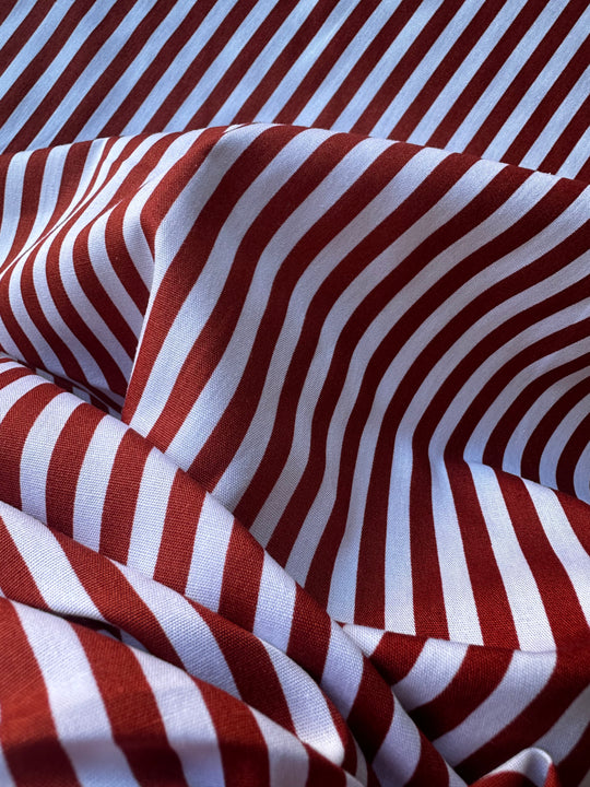 Tessuto a righe rosso/bruciato